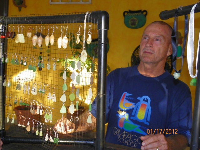 Bobby Barry with jewelry he has made.  Mostly seaglass and beans.